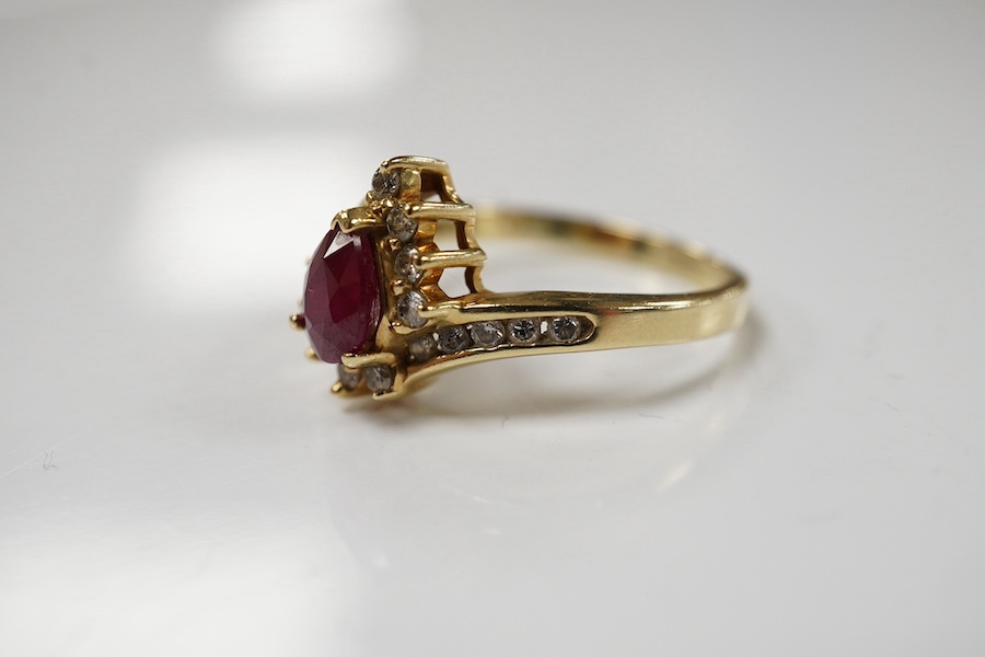 A recent 14k, ruby and diamond cluster set dress ring, size O, gross weight 3.4 grams. Condition - fair to good